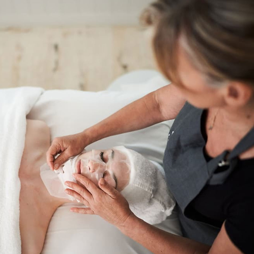 Lady Doing A Facial On A Woman — Selenas Beauty Studio in Petrie, QLD